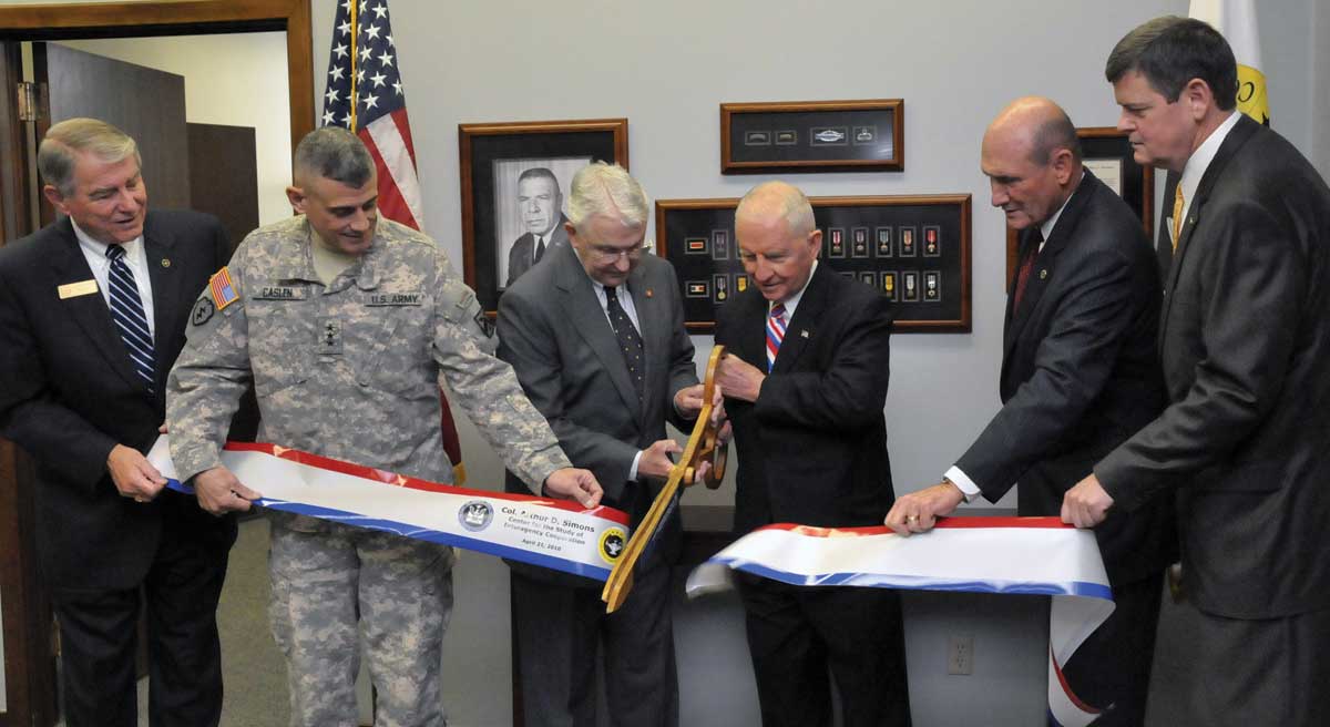 From left, Foundation CEO Bob Ulin, Fort Leavenworth Commander/CGSC Commandant Lt. Gen. Robert L. Caslen, Jr., Foundation Chairman Lt. Gen. (Ret.) Robert Arter, Ross Perot, Foundation President Hyrum Smith, and the Chief Operating Officer of the Simons Center, Maj. Gen. (Ret.) Ray Barrett, cut the ribbon for the opening of the Col. Arthur D. Simons Center for the Study of Interagency Cooperation, April 21, 2010. (photo by Don Middleton, Fort Leavenworth VISE)