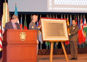Lt. Col. (GS) Hans-Jakob Reichen, Switzerland and Maj. Muhammad Iftitah Sulaiman, Indonesia, present the international officer class of 2016 gift to the College during the International Officer Badge Ceremony June 9. – Click the photo to view the gallery of all photos of the ceremony.