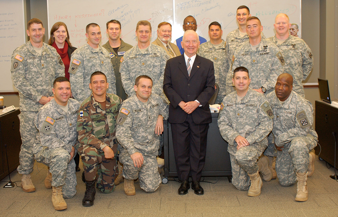 Ross Perot takes a group photo after participating in class discussion with CGSC Professor Bud Meador and his students during his visit to the College Oct. 20, 2009.