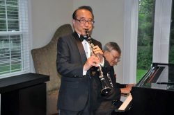 Benny Lee plays his clarinet at one of many receptions he has hosted for the CGSC Foundation.