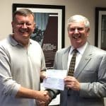 Rich Holden (left), the Northrop Grumman Technical Services Program Manager for Combined Arms Center and Fort Leavenworth programs, presented two sponsorship checks to Doug Tystad, CGSC Foundation CEO, at the Northrop offices in Leavenworth, Kan., on Nov. 22.