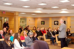 CEO Doug Tystad speaks to attendees at the Art of War Exhibit at the Lenexa, Kansas City Hall Art Gallery on March 2.