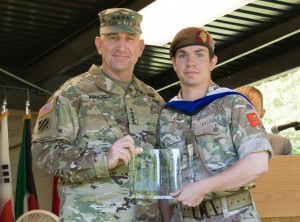 Maj. David T.M. Welford, United Kingdom, receives the General Dwight D. Eisenhower Award for top International Graduate from Gen. Robert B. “Abe” Abrams during the CGSOC graduation ceremony June 9.