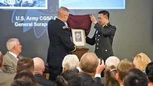 CGSC Commandant Lt. Gen. Michael Lundy and Gen.  Surapong Suwana-adth, Chief of Defense Forces, Royal Thai Armed Forces, unveil the portrait of Surapong that will be displayed in the CGSC International Hall of Fame in the Lewis and Clark Center.