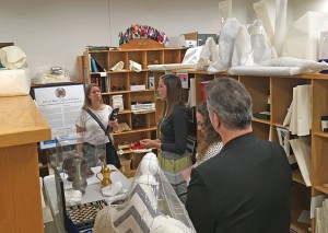 Freelance writer Anne Kniggendorf, left, explores the CGSC art and gift collection with reps from the Todd Weiner Gallery Aug. 15. From left, Kniggendorf, Meghan Dohogne, Poppy DiCandelero, and Todd Weiner.