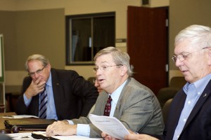 From left, Foundation Legal Advisor Lt. Col. (Ret.) Thomas Mason, Foundation Chair Mike Hockley, and Foundation CEO Col. (Ret.) Doug Tystad discuss board elections during the August 2017 board meeting at Fort Leavenworth.