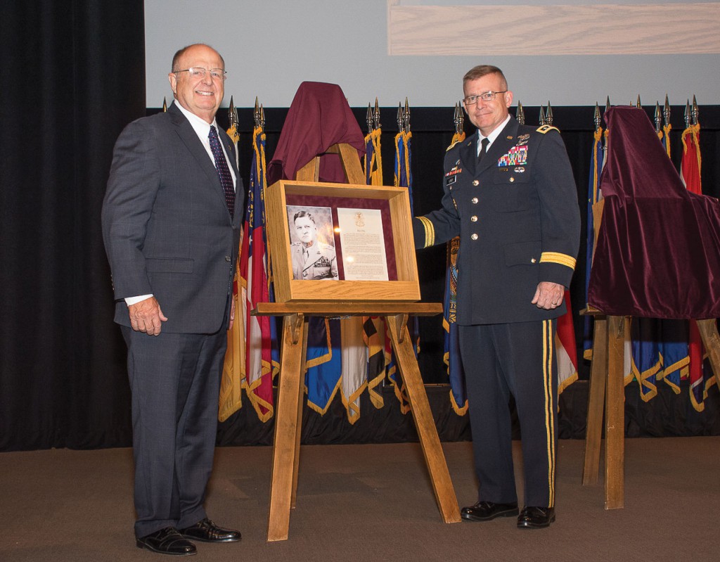 Col. Walton Walker, U.S. Army, Ret., and Lt. Gen. Michael D. Lundy, Commander, Combined Arms Center and Fort Leavenworth, display the shadow box honoring Walker's grandfather, Gen. Walton H. Walker, as an inductee into the Fort Leavenworth Hall of Fame May 30. (photos by Jim Shea/ArmyU Public Affairs)