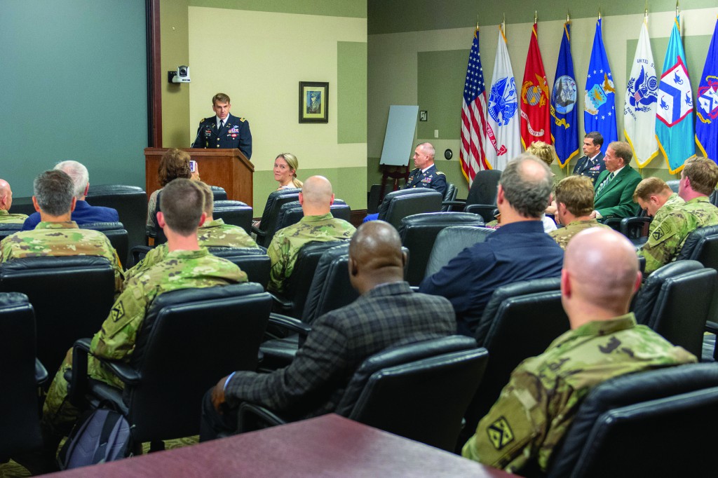 Maj. William J. Doyle delivers remarks after receiving the LTC Ronald C. Ward Distinguished Special Operations Forces Student Award for the Command and General Staff Officer Course Class of 2018 on May 29. Col. (Ret.) Roger Donlon (in green jacket in top right of the photo) was a special guest for the ceremony.