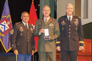 Netherlands Major Rene Berendsen receives the CGSC International Graduate Badge from Brig. Gen. Scott Efflandt, Provost of the Army University and Deputy Commandant of the Command and General Staff College, and Cmd. Sgt. Maj. Eric C. Dostie, Command Sergeant Major of the Combined Arms Center and the Command and General Staff College. (photos by Jim Shea/ArmyU Public Affairs)