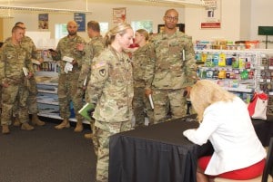 Gen. (Ret.) Ann Dunwoody autographs a book for a CGSC student in the Lewis and Clark bookstore after her lecture.