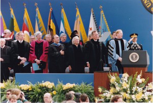 Lieutenant Colonel Gregor, Professor of Military Science at the University of Michigan, salutes at right, during graduation ceremonies in 1991 with guest speaker President George HW Bush.
