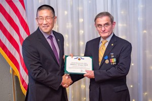 Dr. William J. Gregor, right, receives his Army retirement award from Col. (Ret.) Peter S. Im, an assistant professor at the U.S. Army Command and General Staff School, during his retirement ceremony Aug. 30. (photo by Dan Neal/ArmyU Public Affairs