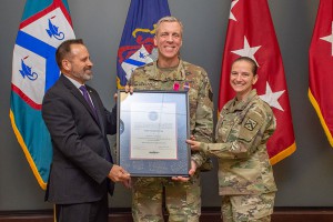 Brig. Gen. Scott L. Efflandt, provost of the Army University, receives the Army University Star from Allen Borgardts, deputy provost, and Command Sgt. Maj. Teresa Duncan in recognition of his service to Army University.
