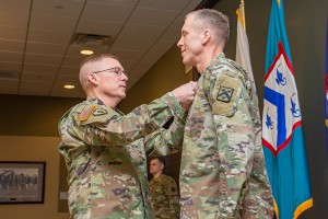 Lt. Gen. Michael D. Lundy, commander of the Combined Arms Center and Fort Leavenworth and Commandant of the Command and General Staff College, presents the Legion of Merit to Brig. Gen. Scott L. Efflandt as he steps down from his position as provost of the Army University and leaves for a new assignment at Fort Hood, Texas. 