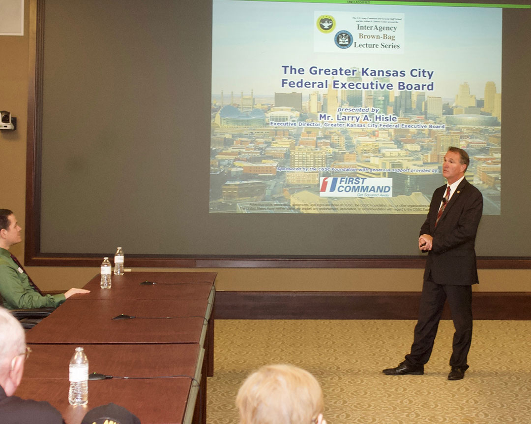 Mr. Larry A. Hisle, executive director of the Greater Kansas City Federal Executive Board, leads a discussion on the roles and missions of the Federal Executive Board in the Interagency Brown-Bag Lecture conducted May 8, 2019, in the Arnold Conference Room of the Lewis and Clark Center on Fort Leavenworth.