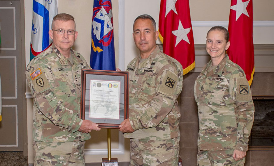 Brig. Gen. Stephen J. Maranian (center) accepts a framed copy of his assumption of responsibility orders from Lt. Gen. Michael D. Lundy, commander of the Combined Arms Center, Fort Leavenworth and commandant of the Command and General Staff College, during the ceremony on June 10, 2019. Maranian is accompanied by Command Sgt. Maj. Teresa Duncan (right), Provost Command Sergeant Major.