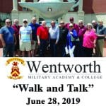 Wentworth Military Academy alumni pose for a photo in front of the Lamp of Knowledge at the Lewis and Clark Center.