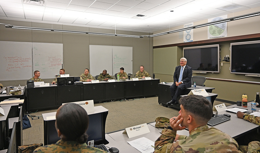 Gen. (Ret.) Carter F. Ham visits with students in their classroom after his presentation of the Powell Lecture for the CGSOC Class of 2020, Aug. 13, 2019.