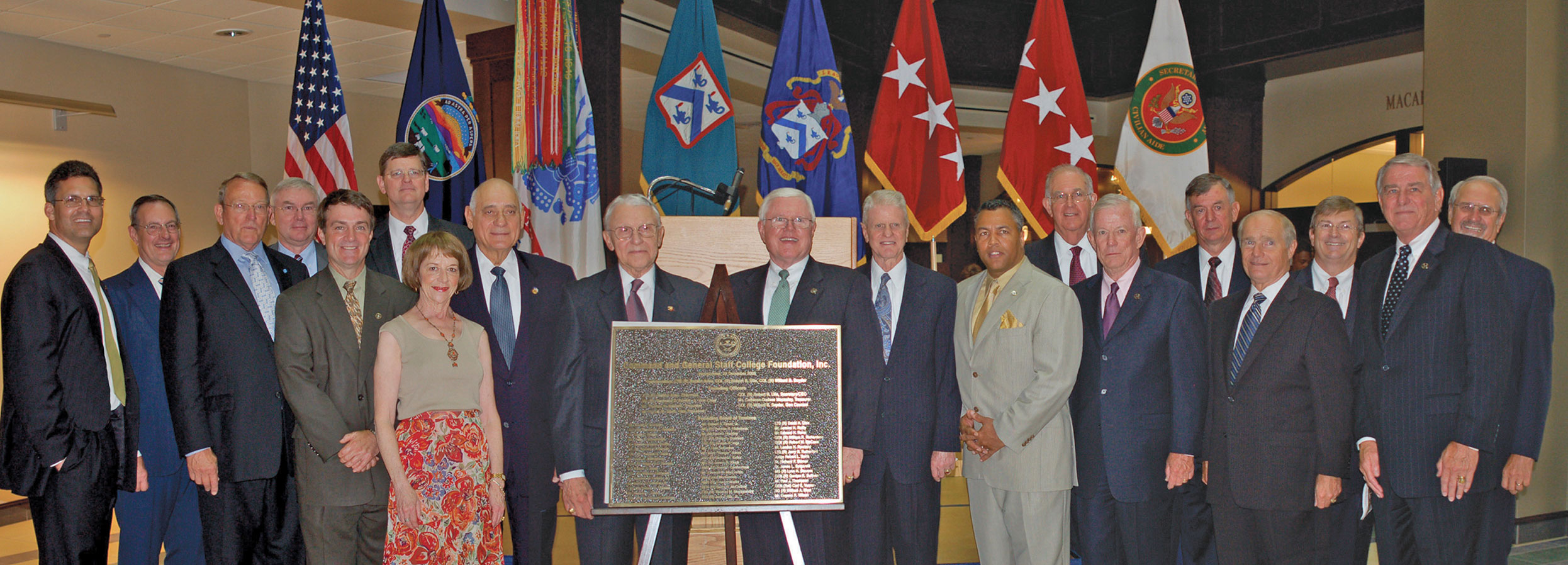 Foundation trustees of the CGSC Foundation gather at a reception in the Lewis and Clark Center on Aug. 12, 2007 and unveil a bronze plaque commemorating the CGSC Foundation’s incorporation. Col. (Ret.) Bill Eckhardt is seventh from right. The Foundation hosted the reception in honor of the College’s official dedication of the building on Aug. 14, 2007.