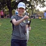 Maj. Yu-yung Chiu, a Taiwanese army officer enrolled in the Command and General Staff Officers Course Class of 2022, shows off the catfish she reeled in during the International Family Fishing Derby Sept. 11 at Merritt Lake.