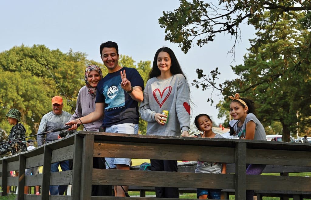 Lt. Col. Ahmed Etman along with his wife and three daughters fish from the dock at Merritt Lake, Fort Leavenworth, during the International Family Fishing Derby on Sept. 11. Etman is an international military student from Egypt enrolled in the Command and General Staff Officers Course Class of 2022.