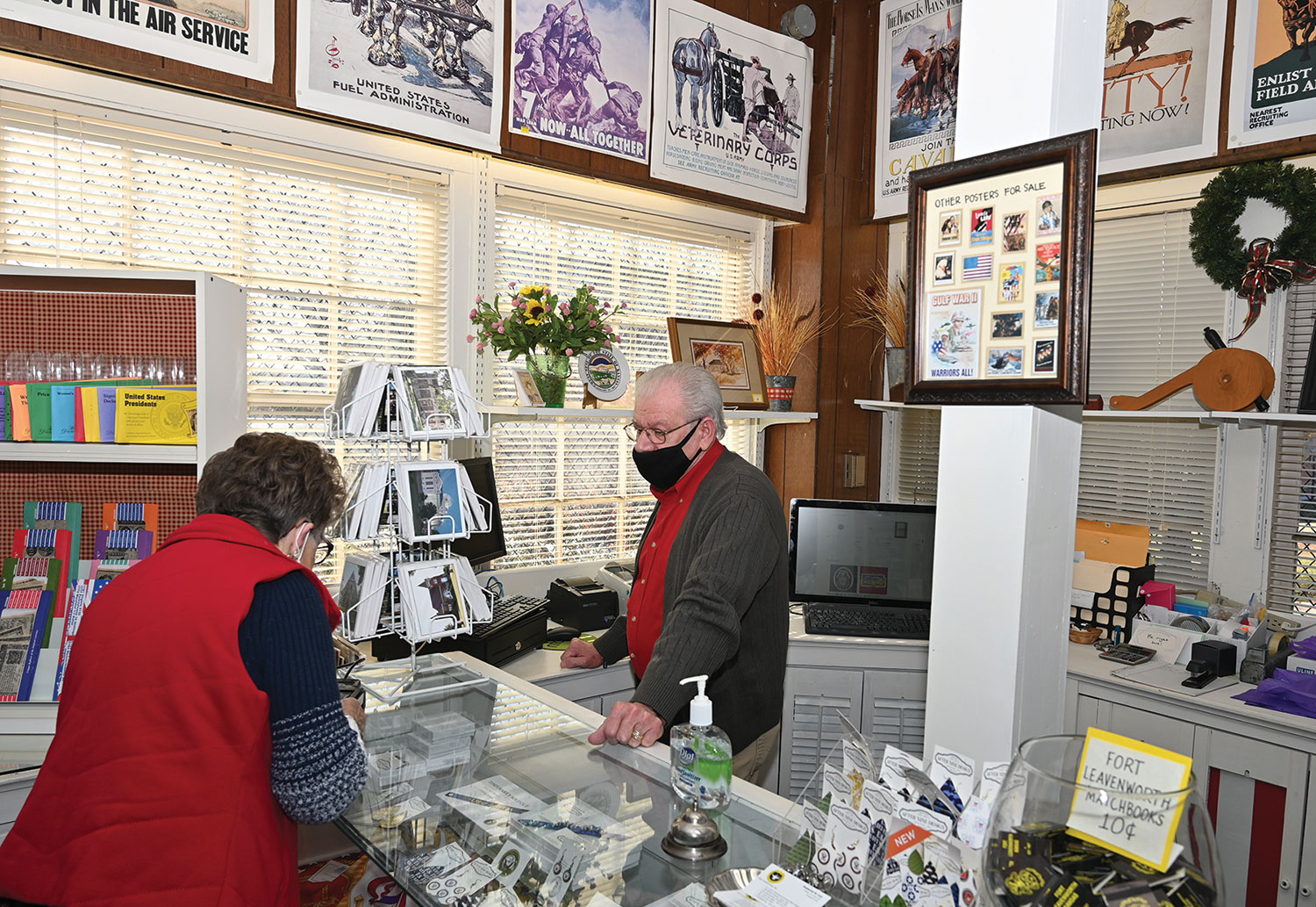 CGSC Foundation Sales Associate Joe Tarwater checks out a customer at the CGSC Foundation's Frontier Army Museum Gift Shop on Dec. 8, 2021.