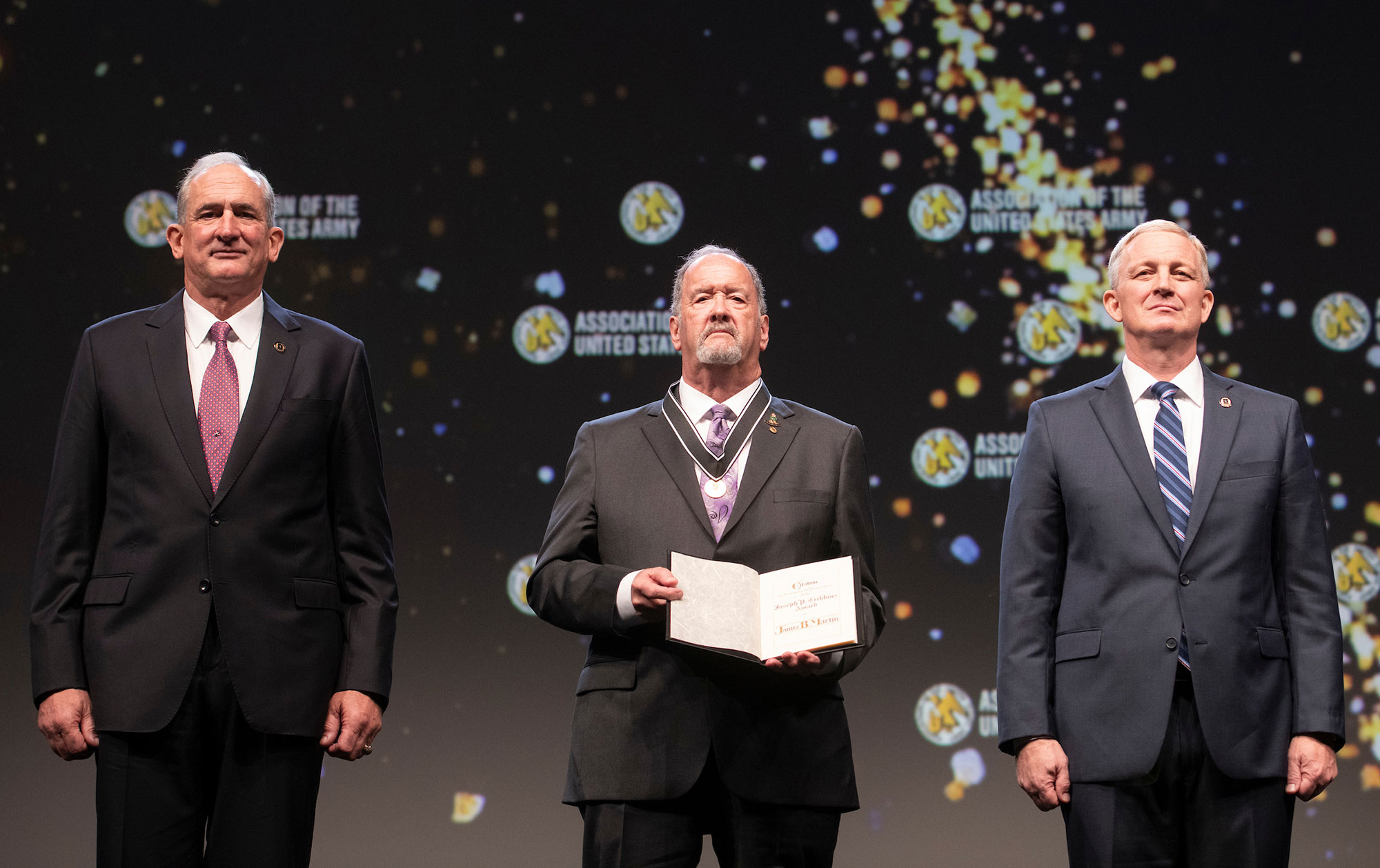 Dr. James Martin, center, received the Association of the U.S. Army's Joseph P. Cribbins Medal for exemplary service by a Department of the Army civilian during the AUSA Annual Meeting and Exposition, Oct. 11 at the Walter E. Washington Convention Center in Washington, D.C.