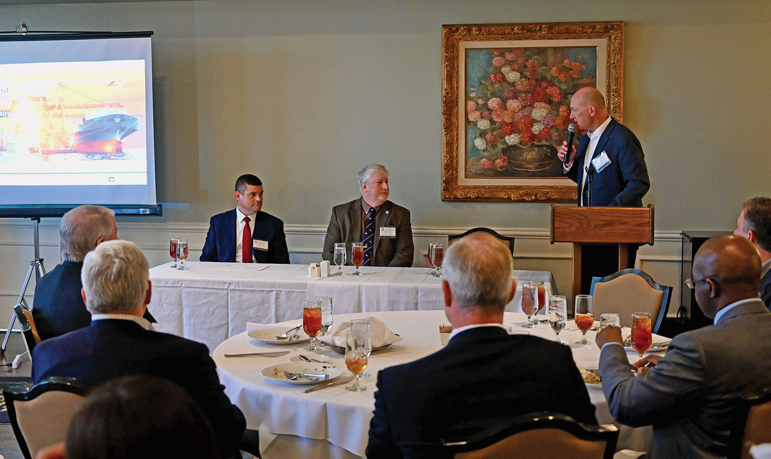 Simons Center Deputy Director John Nelson, right, introduces the panel members for the Arter-Rowland National Security Forum luncheon event on Jan. 27, 2022, at the Carriage Club in downtown Kansas City. From left, retired U.S. Army Col. Matthew Dimmick, former White House advisor and national security professional, and Keith Prather, one of the founders and managing directors of Armada Corporate Intelligence, served as panelists in the forum to discuss the impact supply chain vulnerabilities have on the Kansas City metropolitan area.