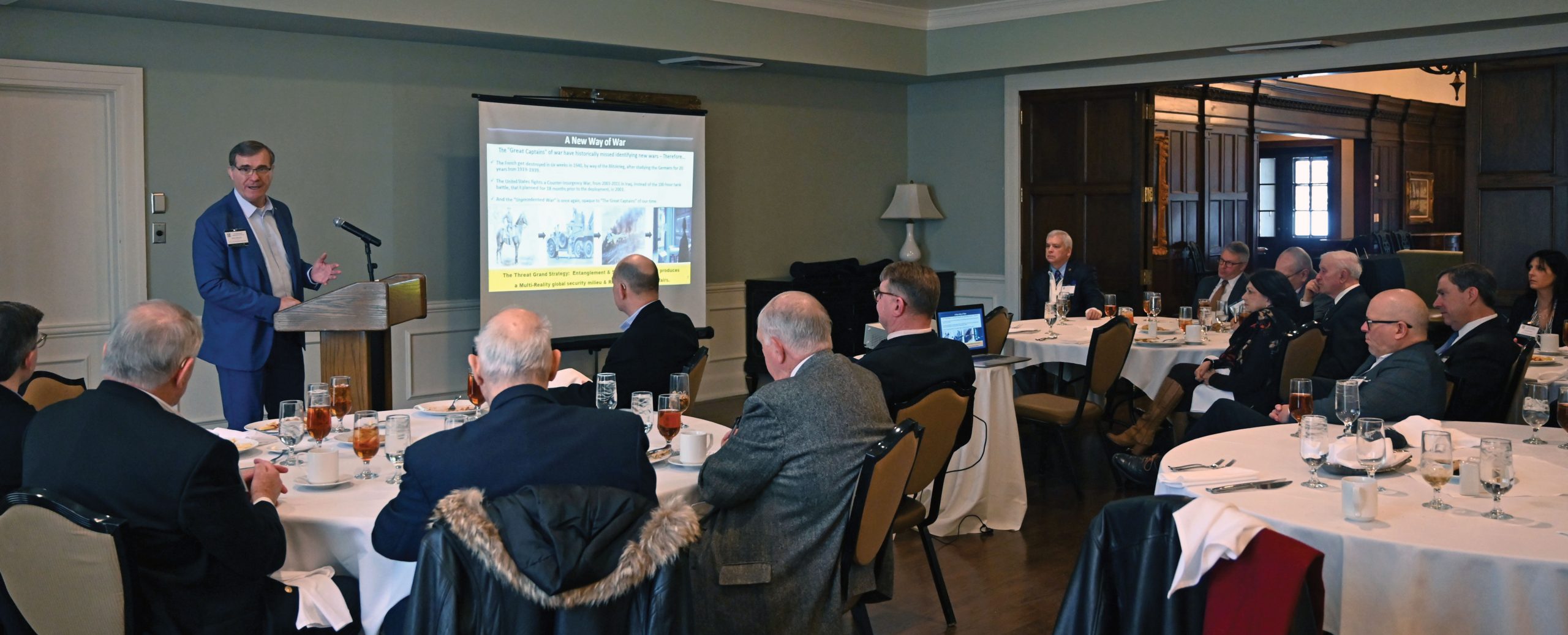 Retired Col. Steve Banach provides his presentation on virtual warfare for the Arter-Rowland National Security Forum luncheon event on Jan. 27, 2022, at the Carriage Club in downtown Kansas City.