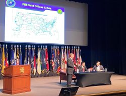 Supervisory Special Agent Dana Kreeger from the FBI’s Kansas City Field Office kicks off the InterAgency Brown-Bag Lecture on April 20, 2022, in the Eisenhower Auditorium of the Lewis and Clark Center.