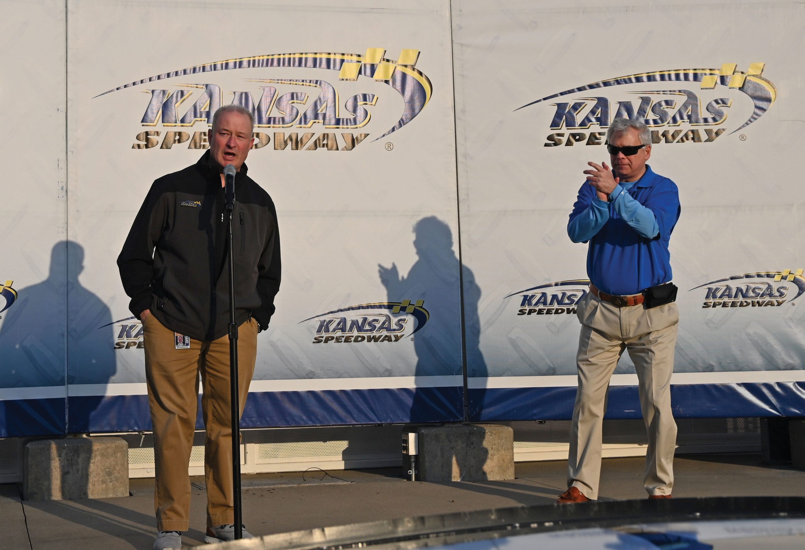 Kansas Speedway President Pat Warren, left, and CGSC Foundation President/CEO Rod Cox welcome attendees to the CGSC Foundation fundraising event at the Kansas Speedway on April 15, 2022.