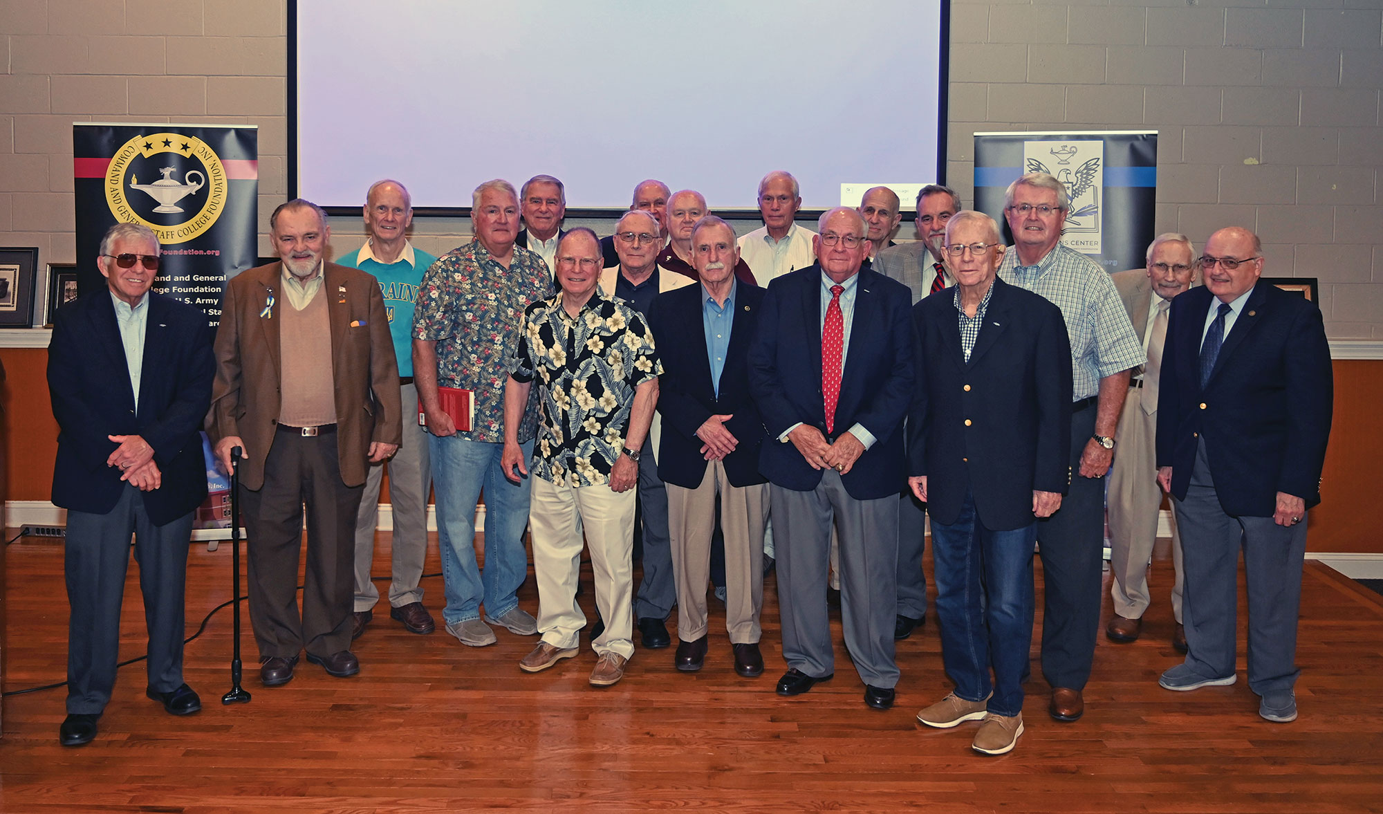 Vietnam veterans gather for a group photo after Dr. James H. Willbanks presented the 14th lecture in the CGSC Foundation's Vietnam War Commemoration Lecture Series on May 12, 2022, at June's Northland in downtown Leavenworth, Kansas.