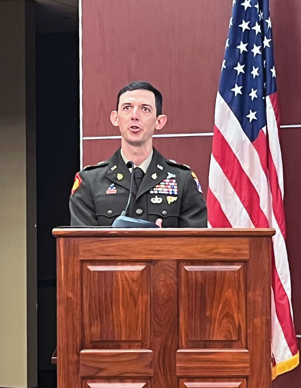 Maj. Joseph A. Bedingfield recipient of the 2022 LTC Ronald C. Ward Distinguished Special Operations Forces Student Award, delivers remarks during the award ceremony on June 9, 2022, in Marshall Auditorium of the Lewis and Clark Center on Fort Leavenworth.