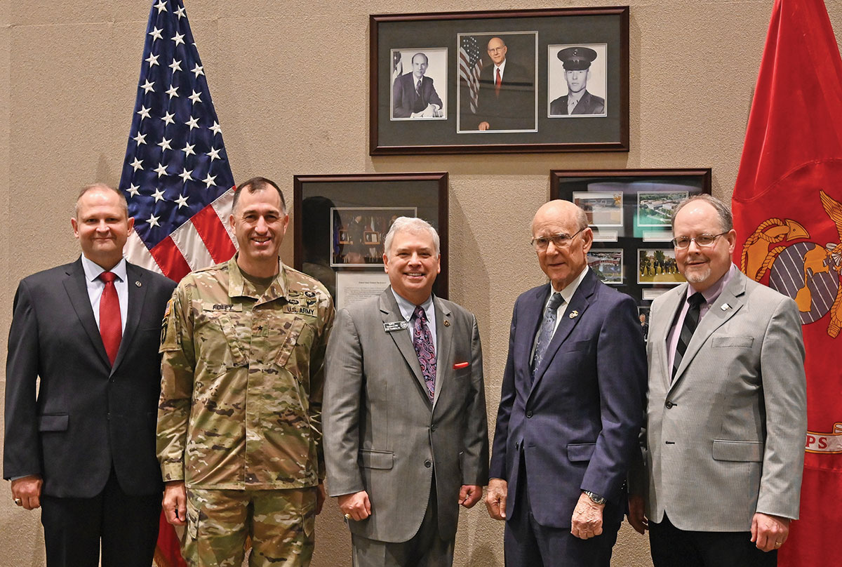 From left, CGSC Foundation Chair Brig. Gen. (Ret.) Bryan W. Wampler, CGSC Deputy Commandant Brig. Gen. David Foley, CGSC Foundation President/CEO Col. (Ret.) Roderick M. Cox,  Sen. Pat Roberts and CGSC Dean of Academics Dr. Jack D. Kem, pose for a group photo in front of the Senator Roberts display in the "Roberts Room," before the start of the Class of 2023 Powell Lecture on Sept. 9, 2022. The Roberts Room, the premier conference room in the Lewis and Clark Center, was named in honor of Sen. Roberts for his perseverance in getting legislation passed to build the Lewis and Clark Center in 2007.