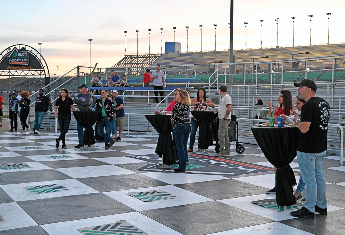 Guests gather for food and drinks in the Victory Lane area during the CGSC Foundation’s event at the Kansas Speedway on Oct. 21, 2022.