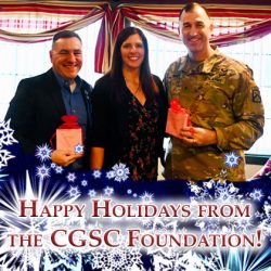 CGSC Foundation Director of Operations Lora Morgan presents Foundation holiday ornaments to door prize winners CGSC Foundation Trustee Pat Proctor, left, and Army University Provost/CGSC Deputy Commandant Brig. Gen. David Foley during the Friends of the Foundation Holiday Luncheon Dec. 16, 2022, at the Baan Thai restaurant in downtown Leavenworth, Kansas.