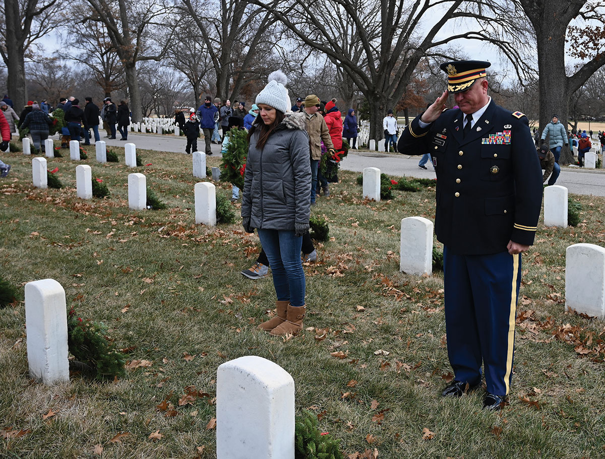 CGSC Foundation Director of Operations Lora Morgan and her husband Col. Mark Morgan participate in laying wreaths at the Fort Leavenworth National Cemetery on Wreaths Across America Day, Dec. 17, 2022.
