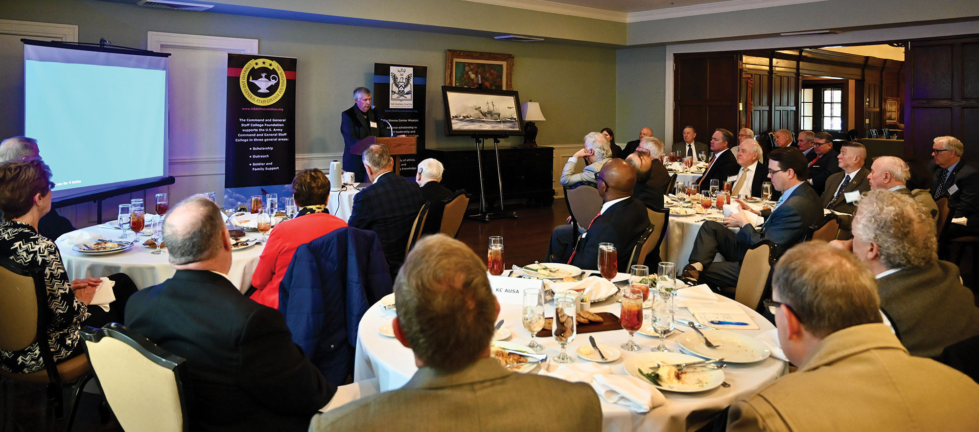 Former crew member of the USS Pueblo Steven Woelk tells the story of his ship's capture and the crew's brutal treatment of the crew by the North Koreans during the Arter-Rowland National Security Forum luncheon event on Jan. 19, 2023, at the Carriage Club in Kansas City.