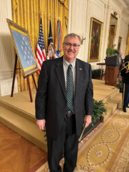 CGSC professor of history Dr. Joseph G.D. (Geoff) Babb poses for a photo in the East Room of the White House after the Medal of Honor ceremony concludes for his former battalion commander Col. (Ret.) Paris D. Davis on March 3, 2023.
