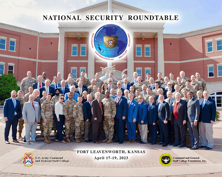 CGSC and CGSC Foundation leadership gather with NSRT guests and their student escorts for a group photo in front of the Lamp of Knowledge outside the Lewis and Clark Center on Fort Leavenworth during the Spring 2023 National Security Roundtable Program on April 18, 2023.