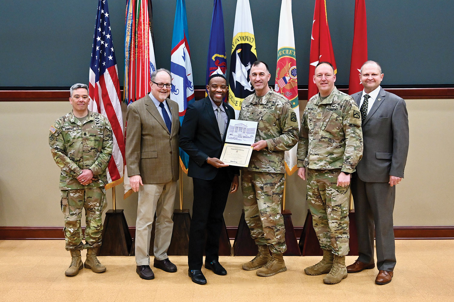 Dr. Adreian Henry, president of Mercy College of Health Sciences (third from left), receives his NSRT certificate of completion from CGSC Deputy Commandant Brig. Gen. David C. Foley. All NSRT guests receive a certificate, along with a group photo and individual photo upon completion of the program. They also receive information about how to stay involved with the Foundation and the College as NSRT alumni. From left: Army University Command Sgt. Maj. Jason C. Porras, CGSC Dean of Academics Dr. Jack D. Kem, Henry, Foley, CGSC student escort Maj. Warner, and CGSC Foundation Chairman Brig. Gen. (Ret.) Bryan Wampler.