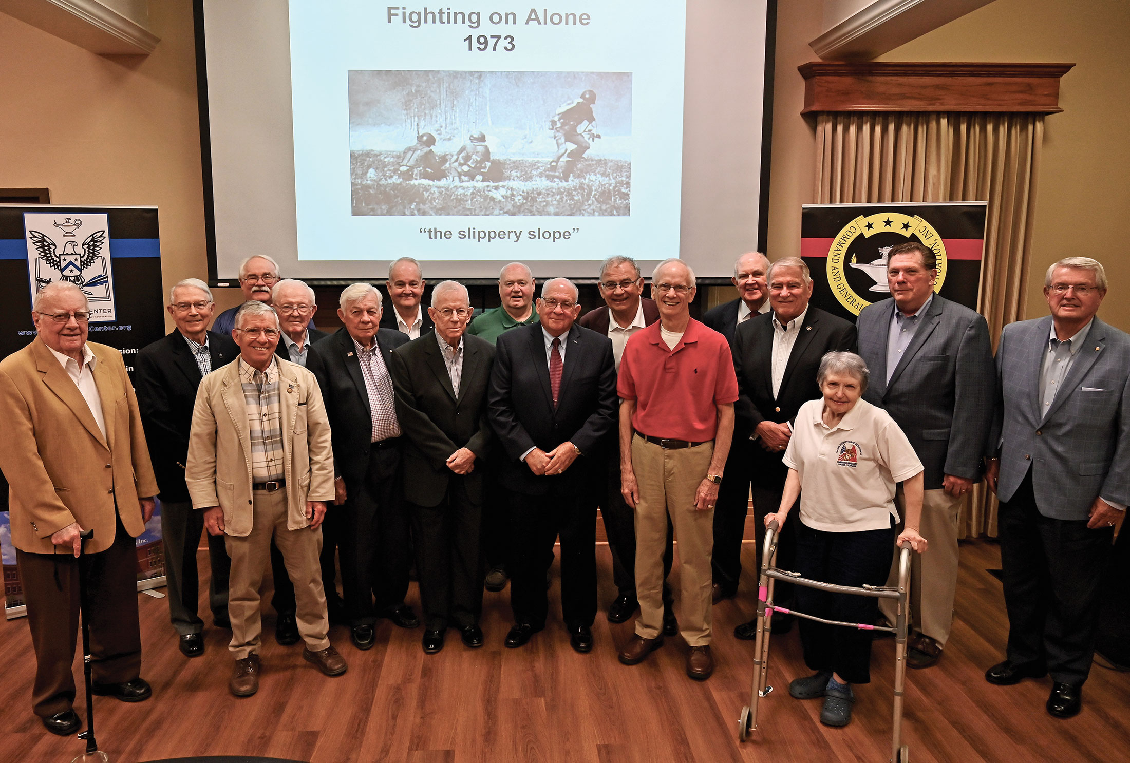 Vietnam veterans gather for a group photo after Dr. James H. Willbanks presented the 15th lecture in the CGSC Foundation's Vietnam War Commemoration Lecture Series on May 9, 2023, at the Riverfront Community Center in downtown Leavenworth, Kansas.