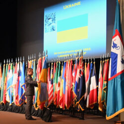 The Ukrainian officer in the CGSOC Class of 2024 posts his country's flag during the International Flag Ceremony conducted Aug. 7, 2023, in the Eisenhower Auditorium of the Lewis and Clark Center on Fort Leavenworth.