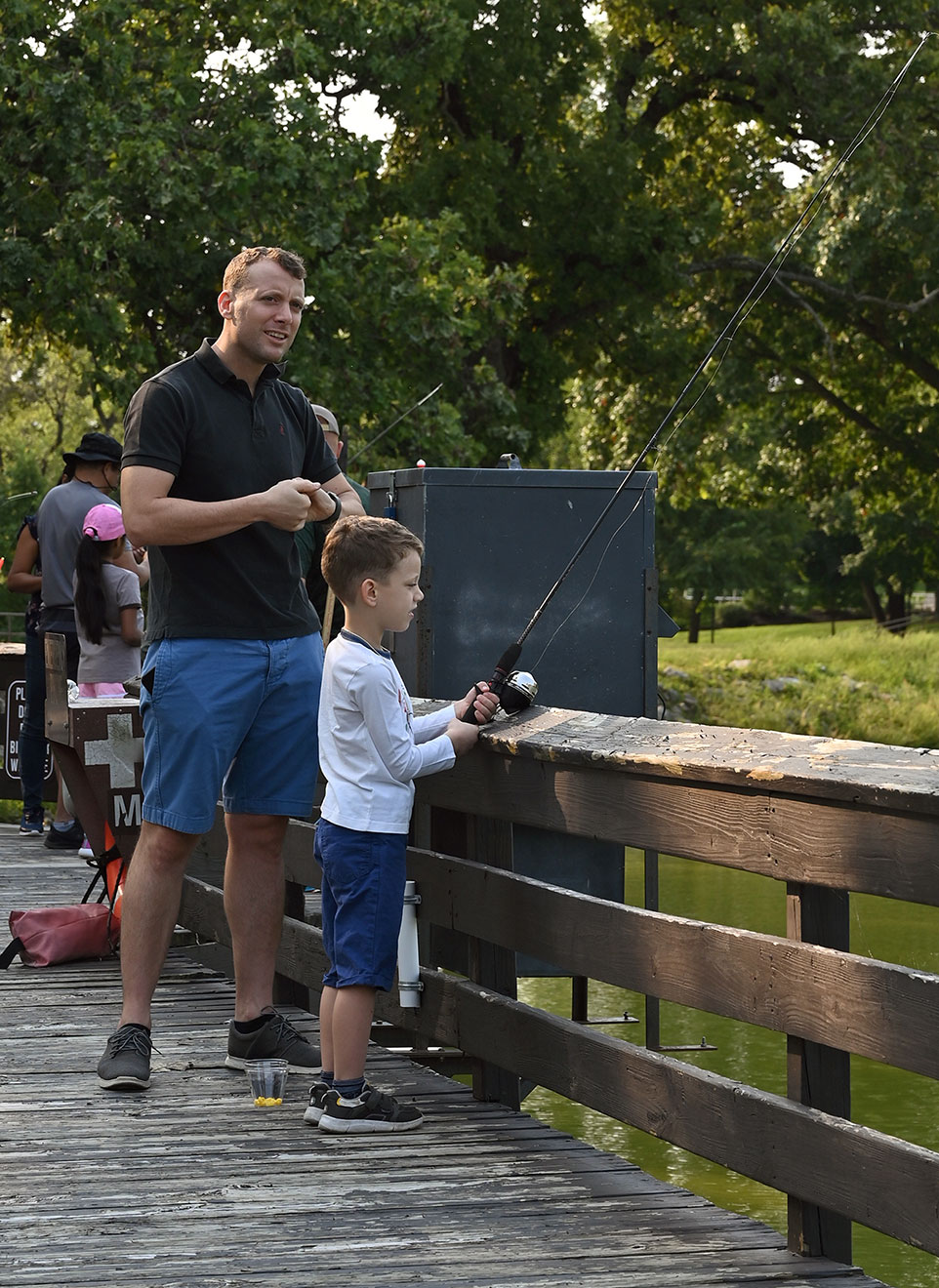Maj. Gaetano Robustelli and his 6-year-old son Leonardo fish off the dock at Merritt Lake, Fort Leavenworth during the International Family Fishing Derby on Sept. 11. Robustelli is an international military student from Italy enrolled in the Command and General Staff Officers Course Class of 2022.