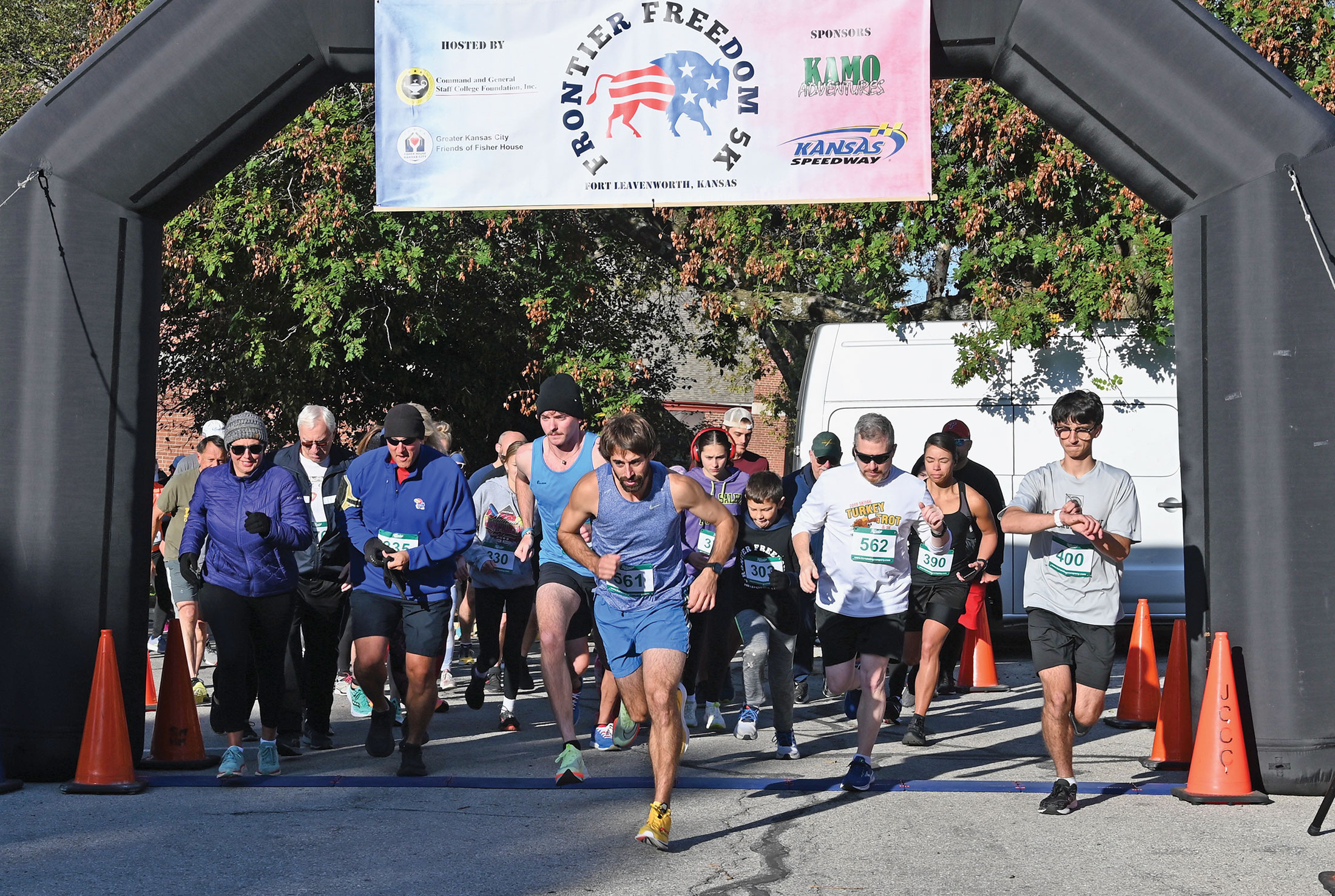 Runners cross the start line at the beginning of the the Frontier Freedom 5K Run/Walk on Fort Leavenworth on Oct. 8, 2023. The race was hosted by the CGSC Foundation and the Greater Kansas City Friends of the Fisher House.