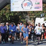 Runners cross the start line at the beginning of the the Frontier Freedom 5K Run/Walk on Fort Leavenworth on Oct. 8, 2023. The race was hosted by the CGSC Foundation and the Greater Kansas City Friends of the Fisher House.