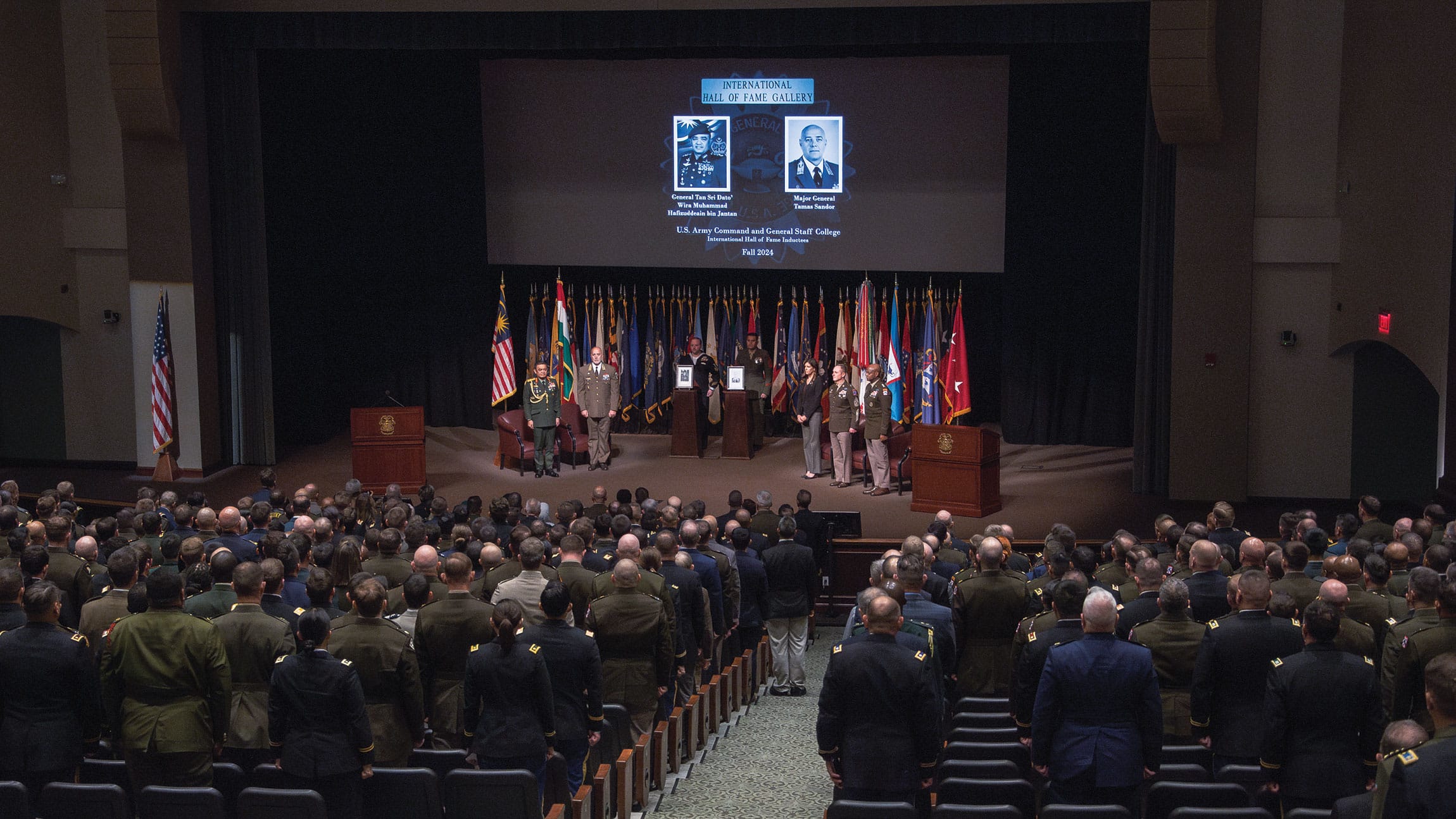 IHOF w Attendees of the Army University’s Command and General Staff College International Hall of Fame induction ceremony stand at attention for the playing of the Malaysian and Hungarian national anthems at the Lewis and Clark Center Oct. 11, 2024.