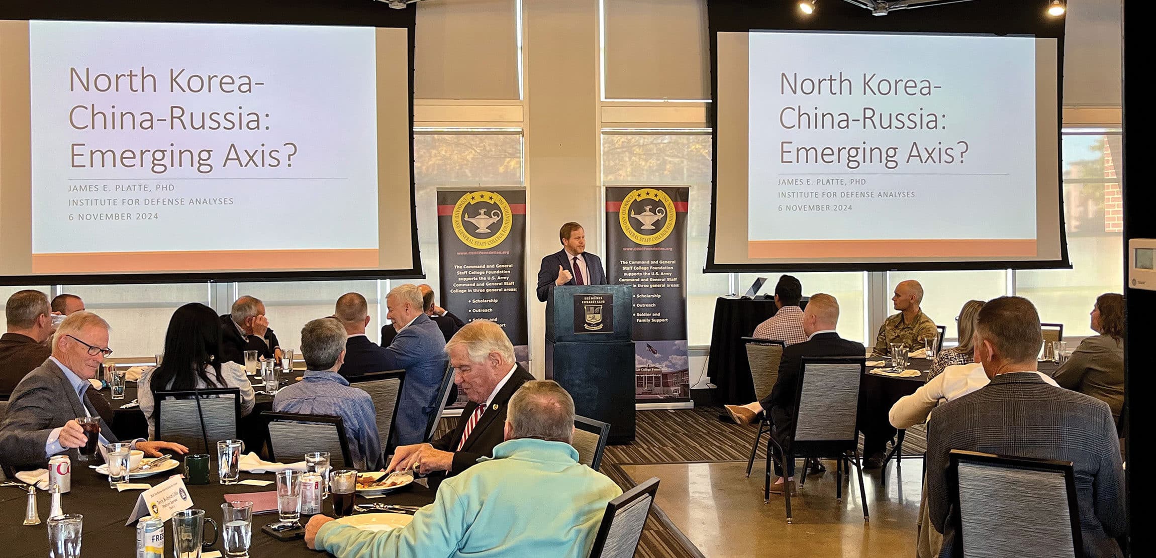 James E. Platte, Ph.D., an analyst with the Institute for Defense Analyses, provides a presentation entitled "North Korea-China-Russia: Emerging Axis?" during the Des Moines National Security Forum at the Des Moines Embassy Club West in West Des Moines, Iowa on Nov. 6, 2024.