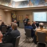 ARNSF-37-5DEC24-30-w CGSC Foundation Chairman Maj. Gen. (Ret.) Christopher P. Hughes addresses members and guests of the Arter-Rowland National Security Forum luncheon event on Dec. 5 2024, at the Kansas City Downtown Marriott in Kansas City.