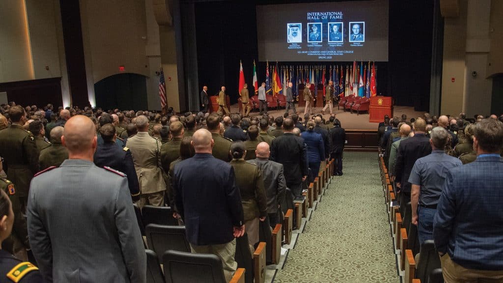 The audience stands for the arrival of the official party of the International Hall of Fame induction Ceremony held March 28, 2025, at the Lewis and Clark Center, Fort Leavenworth, Kansas. (Dan Neal, ArmyU Public Affairs)
